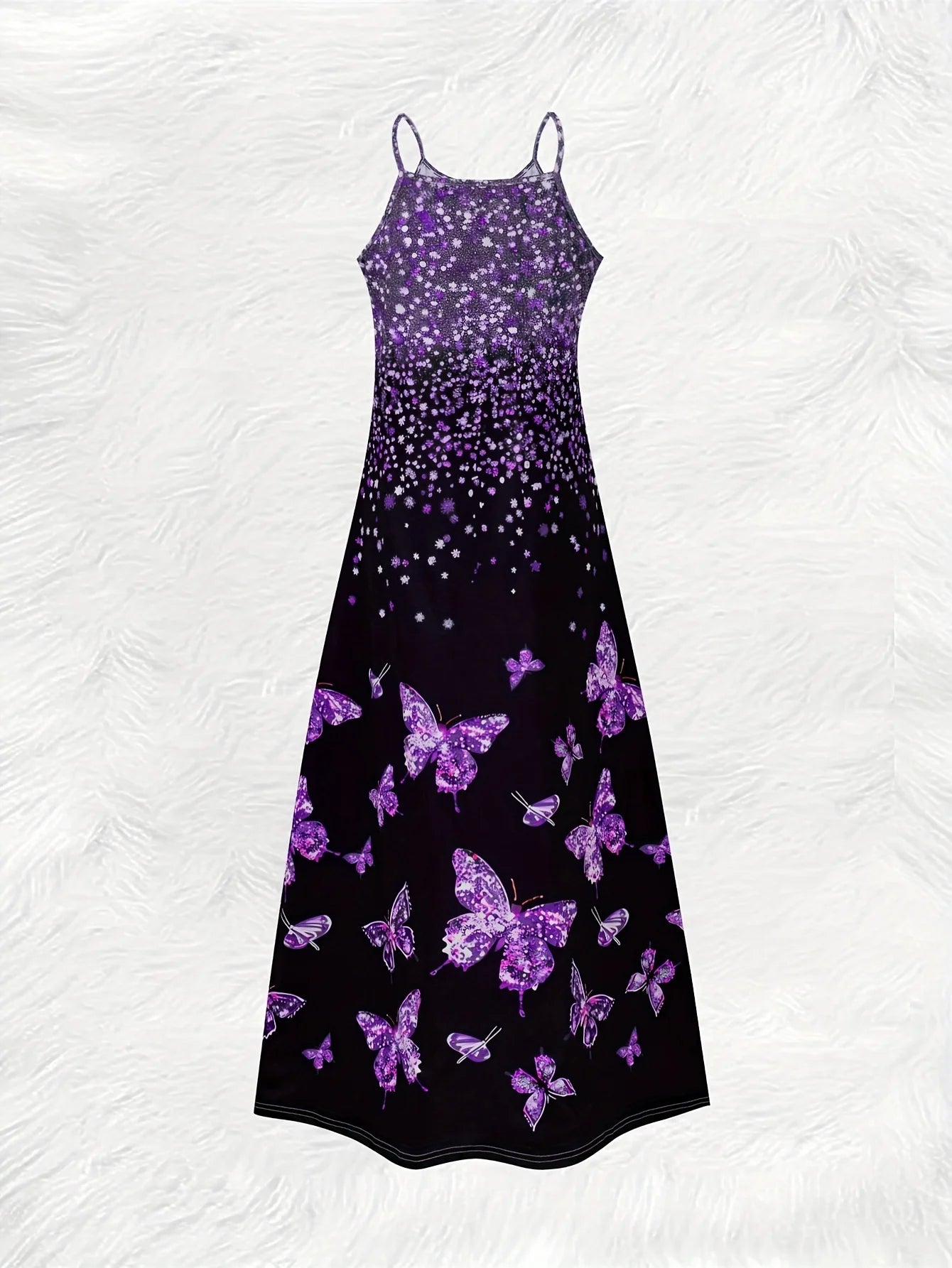 This round neck spaghetti strap maxi dress features a dazzling purple glitter, butterfly print on a sleek black base.