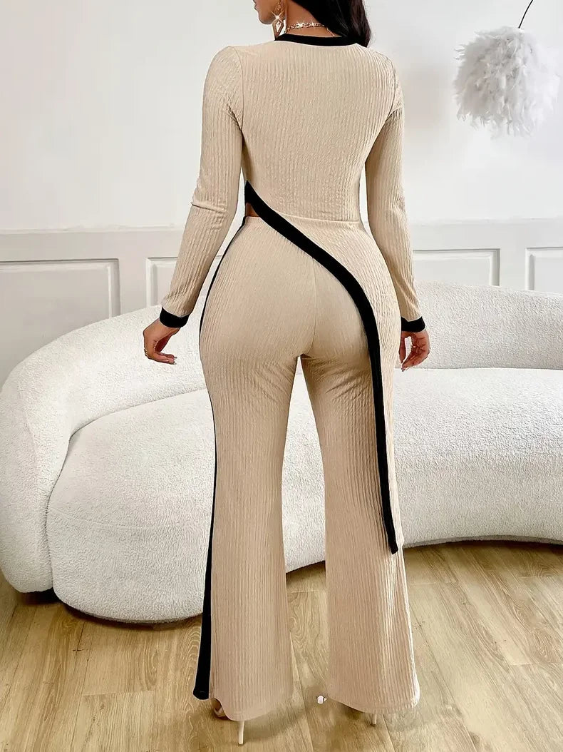 Elegant women's tight fitting asymmetrical hem pants top set for women.